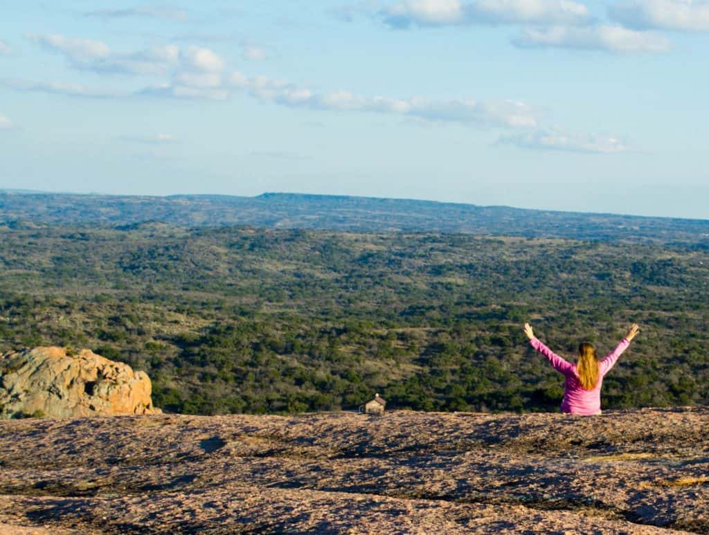 Get a bird's eye view of the Texas Hill Country atop Enchanted Rock. The massive pink granite dome rises rises 425 feet above the base elevation of the park. Its high point is 1,825 feet above sea level, and the entire dome covers 640 acres.