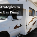 A close-view photo of a white and brown Class A motorhome in a gas station. A person is pumping gas into its tank. Text in the upper left reads "5 Simple Strategies to Save at the Gas Pump."