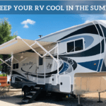 A photo of the Chickery's Arctic Fox 5th wheel with the awning out. It sits in a campsite with a paved patio and bistro-style table and chairs. The bright blue sky above has just a few wispy clouds. Text says "How to keep your RV cool in the summer heat."