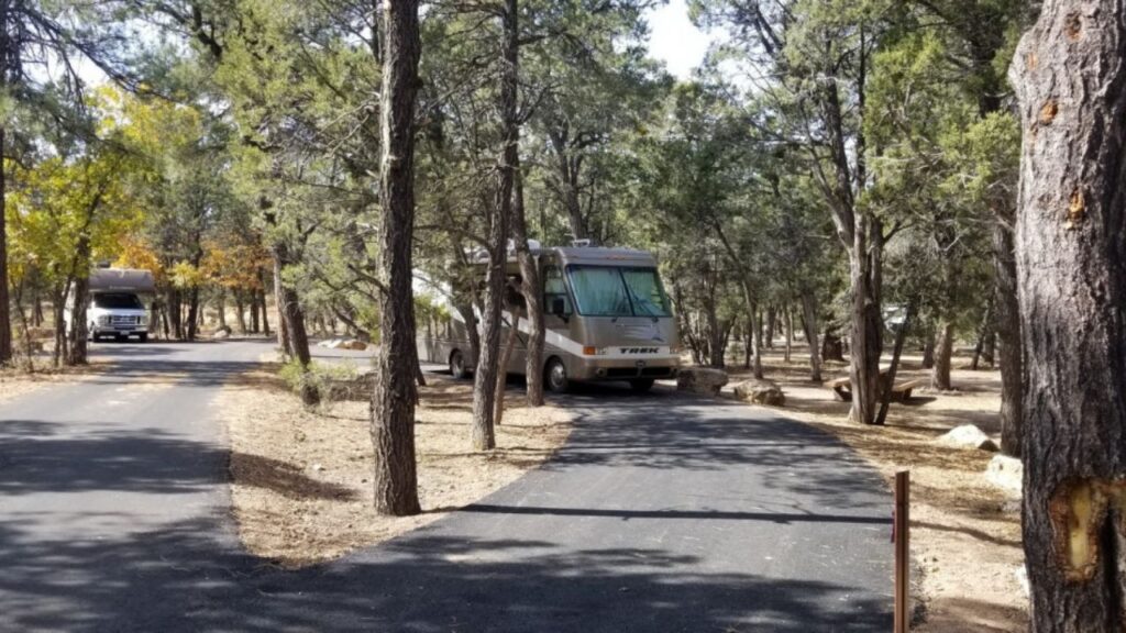 The Mather campground in Grand Canyon National Park has lots of space between its 327 sites, but no hook-ups. However, it is close to the south rim which is accessible by a bike/walking trail or free park shuttle.