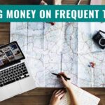 Travel planning scene with computer, map and camera