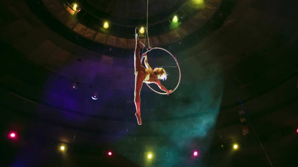 Acrobat spinning high above the crowd